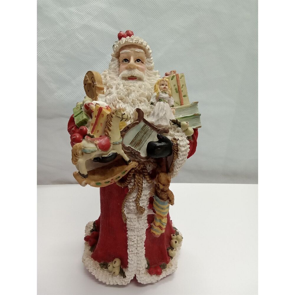Santa Figurine ceramic holding gifts appox 9x5x5